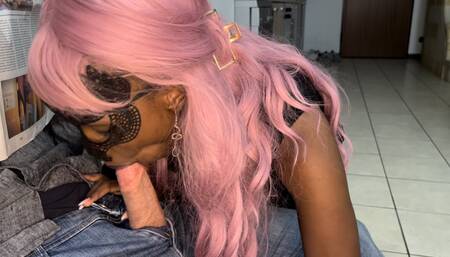 Ebony slut gives blowjob to a friend while he reads the newspaper