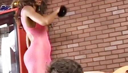 Black Goddess in pink fishnet body spank her white slave.