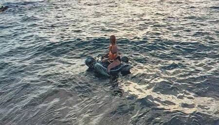 Alla sexy rides on an inflatable turtle through the waves and wears inflatable bandages on her arms!!!