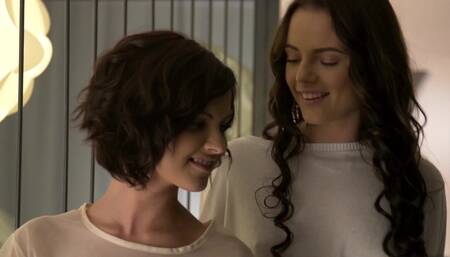 Two black haired girls are touching and teasing one another