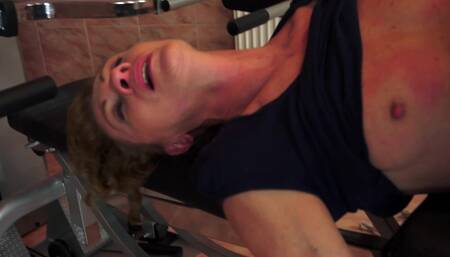 A nasty granny is getting her ass fingered in this video