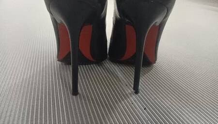 Katherine modeling her classic black pumps