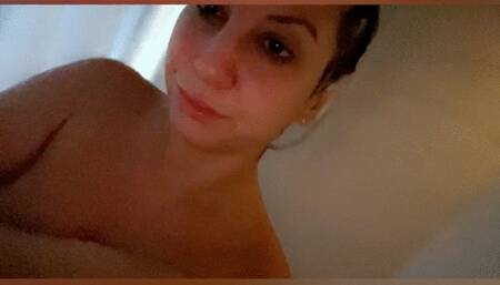 In the shower with my vibrator and I get plenty wet!