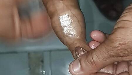 Indian middle age man massage his pennis with oil and gel