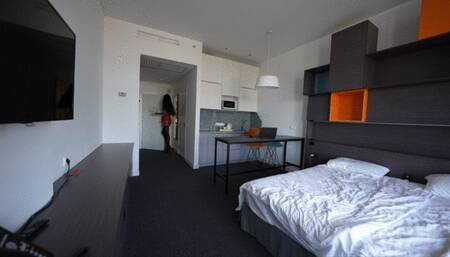 Molly in a short red leather skirt and black pantyhose