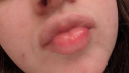 Showing off my mouth and tongue while I try on different kinds of lip gloss