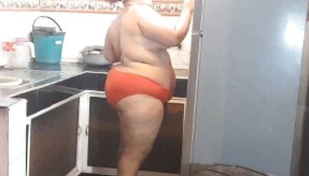 spying on my chubby neighbor in the kitchen.