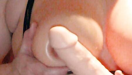 Dildo between my big rubber tits