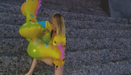 Alla deflates inflatable dragon and pool toys on the beach!!!