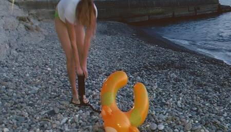 Alla found an abandoned inflatable ring on the beach and decided to destroy it with a hand pump!!!