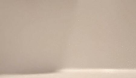 Scrubbing Bathtub with Rubber Gloves