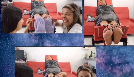 Ceci tickles Gisela's soles with the help of other hands