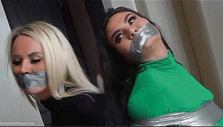 Amber & Jersey in: FireBrand StakeOut Babes Should Have Stayed Put - Now They're Boob-Banded Hostages in Frantic Peril! (WMV)