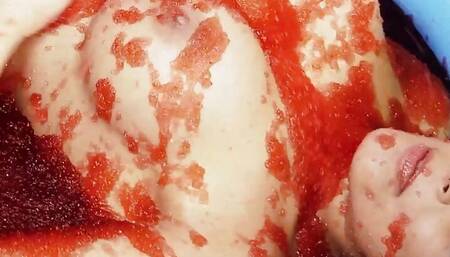 Kissing turns into food wrestling between the two brunette