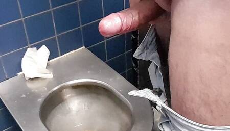 Big fat cock with ring jerk off in public toilete in Germany.