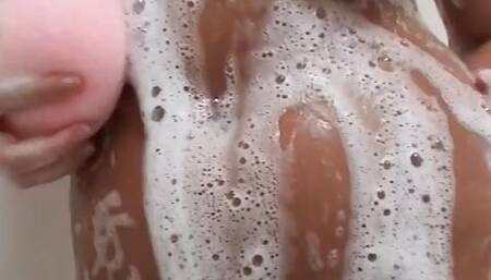 Horny Jessica takes off her green bikini to wash herself in a sexy way