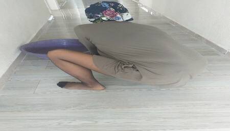 Turkish Woman in hijabs nylon stockings wipes floors