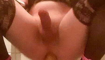 Sissy swings her clitty while riding huge dildo