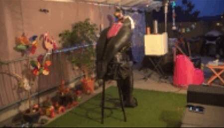 Helpless in the Bolero Armbinder on the Bar Chair