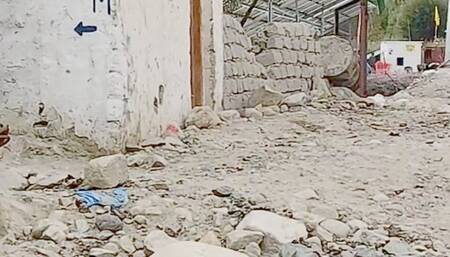Girl pissing in a dirty street Indian style toilet in the mountains