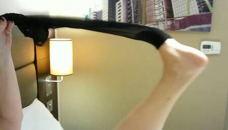 Undoing those suspender clips, and slipping off those stockings