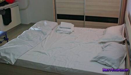 Jeans sitting and jerking him with her hand