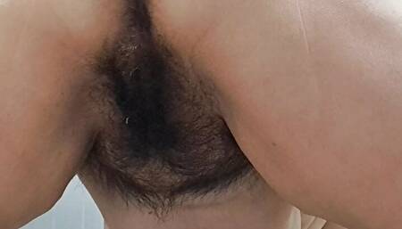 spreading legs and hairy pussy