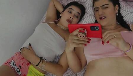 Bisexual stepsisters get horny watching a lesbian video - Porn in Spanish