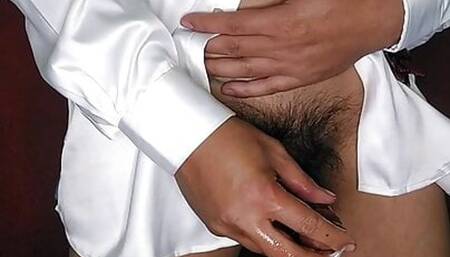 Massaging with oil in satin shirt and tie