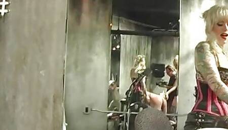 Pretty punk blonde femdoms dominate a bound guy