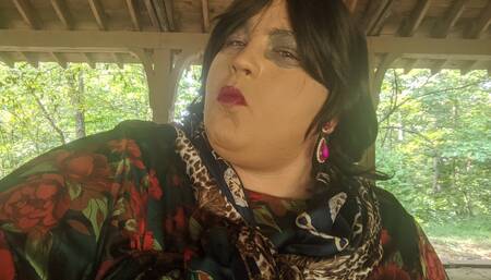 Sexy Crossdresser at the park getting ready to start swinging on the swing in the park.