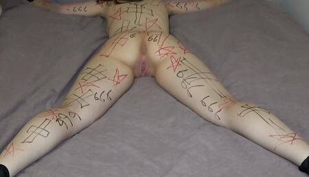 Obsessed girl tied to the bed getting exorcism by the priest Halloween