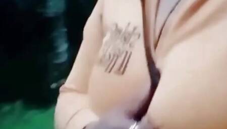 crazy woman sharing her big tits on public street