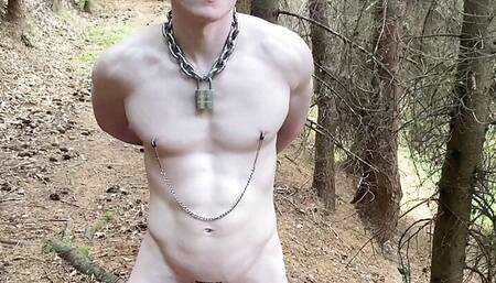 Slave hiking naked and locked in a forest