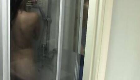 Showering teen dries off on spy cam