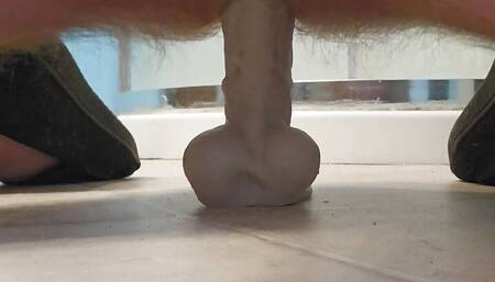Masturbating with a dildo