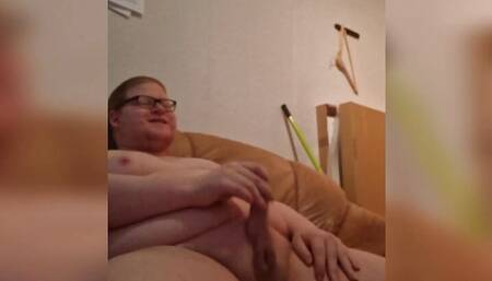 Fat boy jerks off while sitting