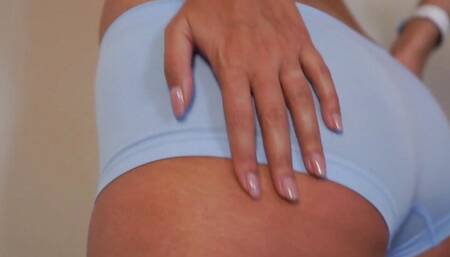 A GIRL WITH A SEXY ASS SLOWLY MOVES AND REMOVES HER PANTIES