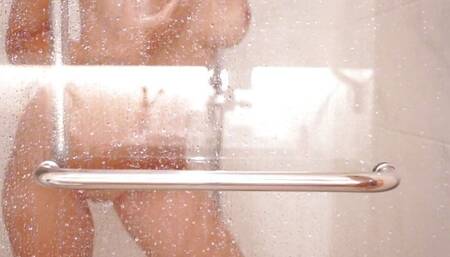 A SEXY BLONDE TAKES A SHOWER AND TOUCHES HERSELF