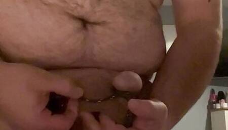 Cock and ball bondage in one piece swim suit CBT