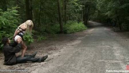 Strapped blonde fucked in the woods