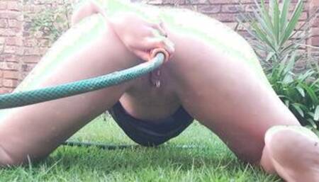 Long butt anal hoe cleansing her asshole with a garden hose