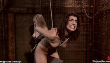 Back arched lesbian slave gets whipped