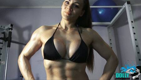 Biceps flexing in black bikini - oiled body