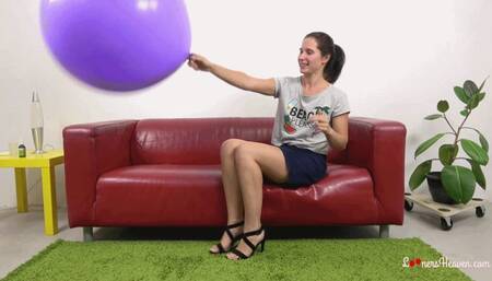 Nikol blows up giant purple balloon (4K)