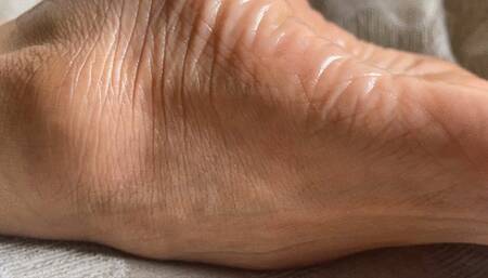 Milah Arches extreme close up foot soles