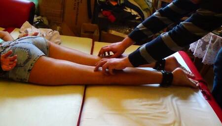 Magda is facedown and tickled legs and feet