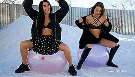 Girls sit pop huge crystal on the snow 4K UHD