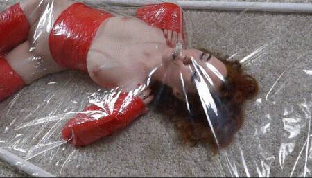 Red stretch film bondage in a vacuum bed