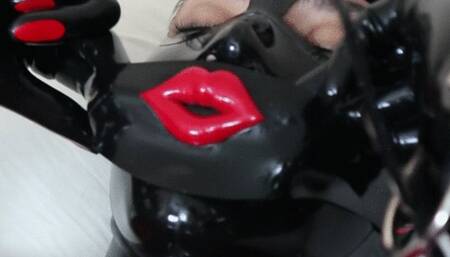 Latex Rubberdoll Applies Blindfold and Gag and Uses Vibrator on Rubber Pussy
